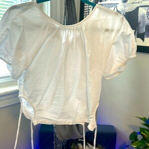 Cute white shirt ties on the sides made by Madewell